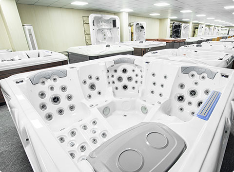 a line of swim spa and hot tub molds