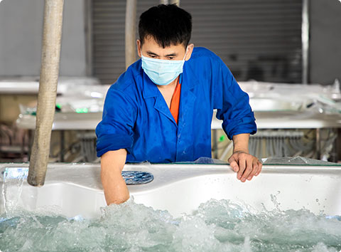 technican in Voomig is testing the power of valve that has been installed in the tub 