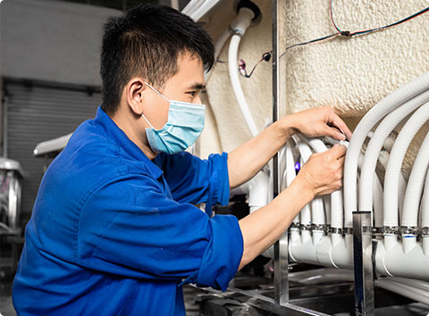 technician is assembling the parts of hot tub 